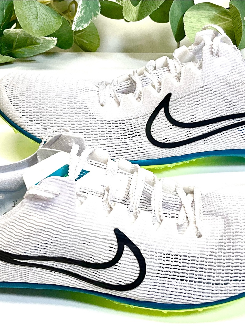 Nike White Men's Running Sneakers with Black Swoosh and Blue-Green Accents